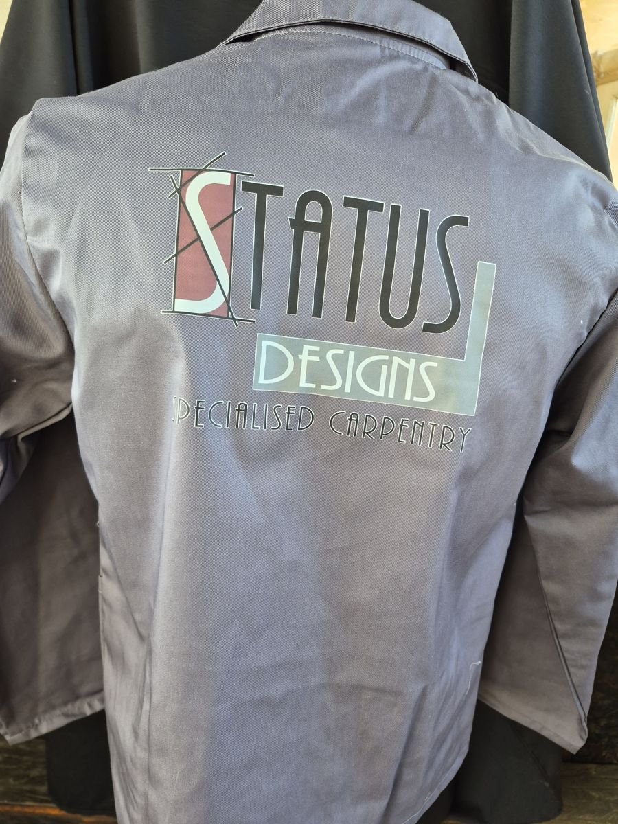 Grey work jacket branded with a company logo